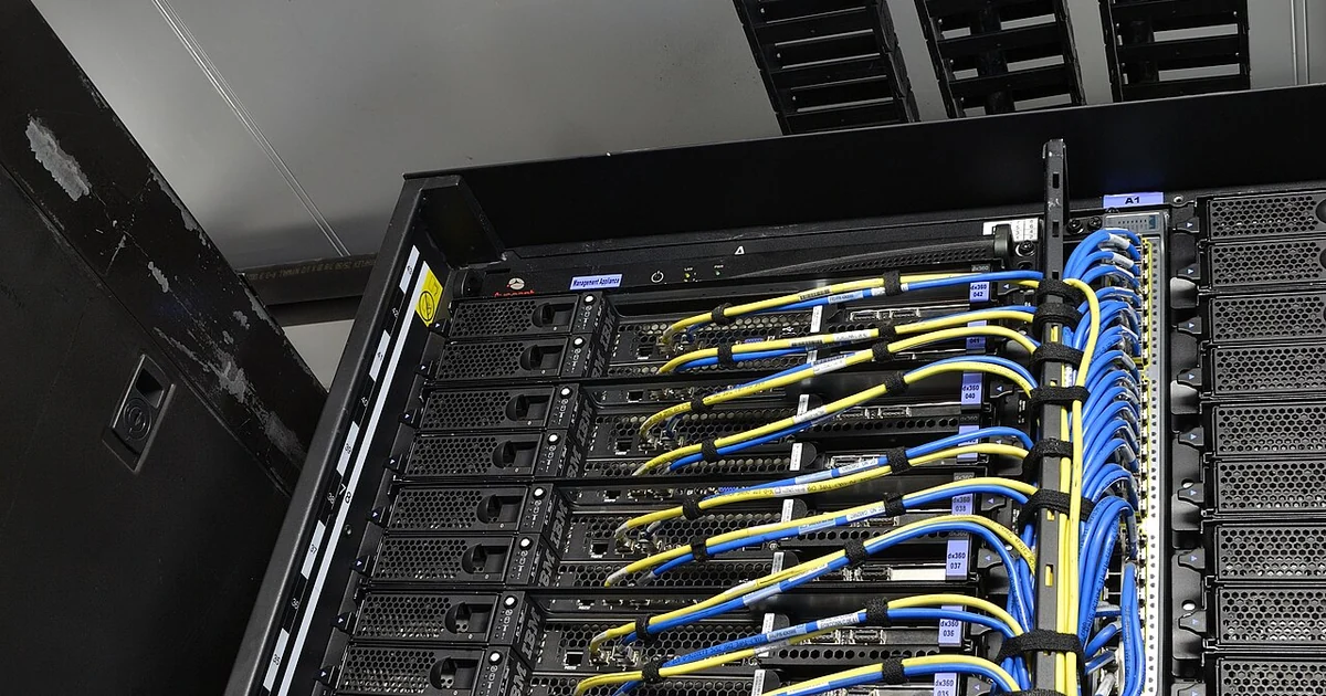 IBM Portable Modular Data Center - power, network cable rails into the server rack (high-density iDataPlex rack).